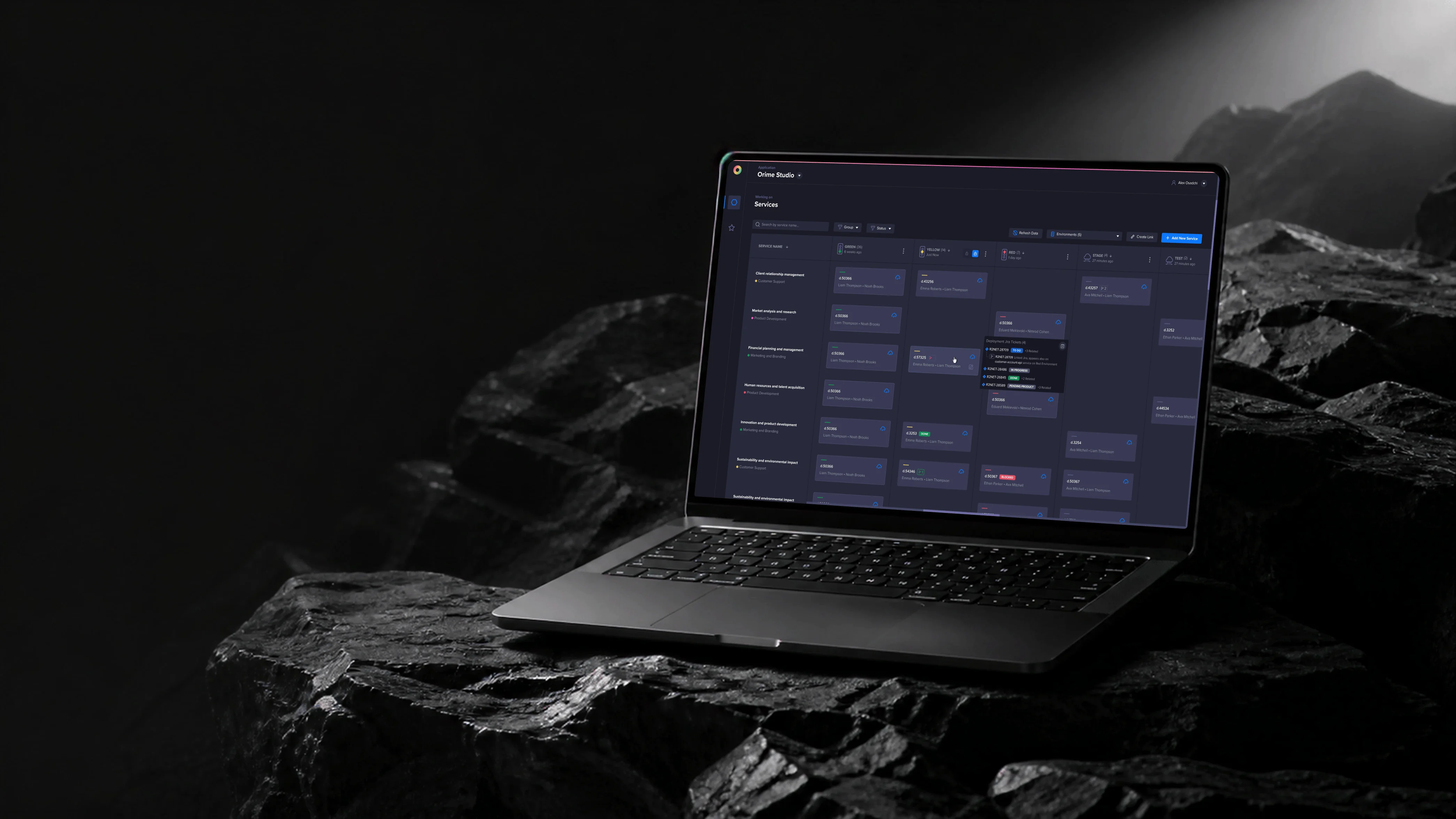 Laptop showing the Zero services board with environment columns, service cards, and a Jira details popover on a dark stone set.
